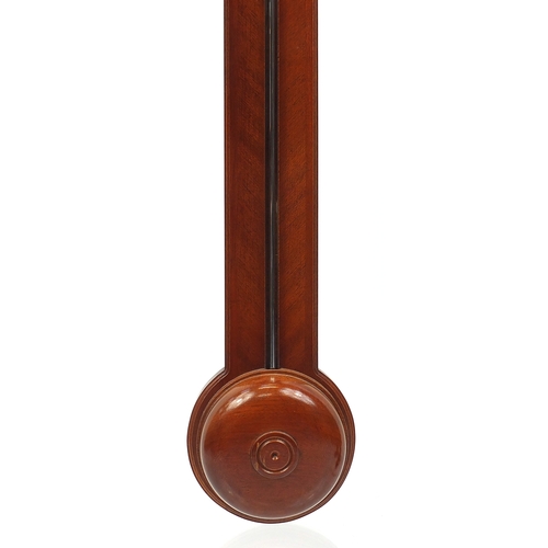 1142 - Mahogany wall stick barometer with silvered dial and broken arch pediment and urn finial, 97cm high