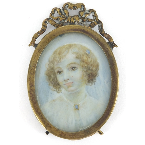 6 - Two oval hand painted portrait miniatures one of a lady and one of a young girl, both housed in bras... 