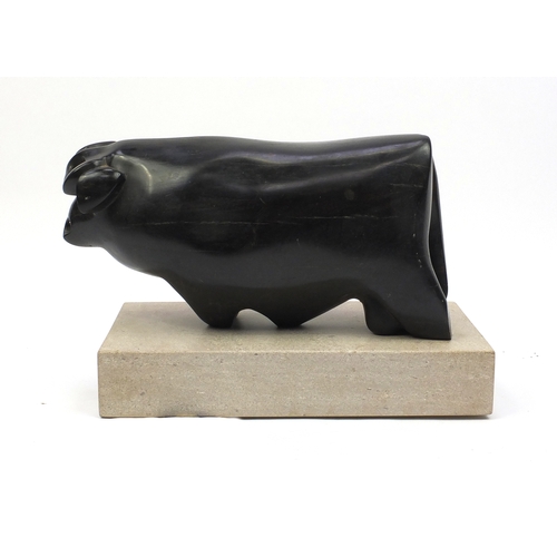 33 - Caroline Byng Lucas 1886-1967, Bull, large ebony sculpture on rectangular stone plinth, exhibited in... 