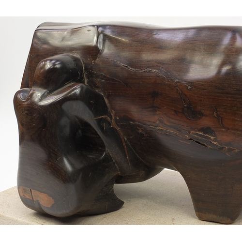 34 - Caroline Byng Lucas 1886-1967, Cow & Milkmaid, large African hardwood sculpture on rectangular stone... 