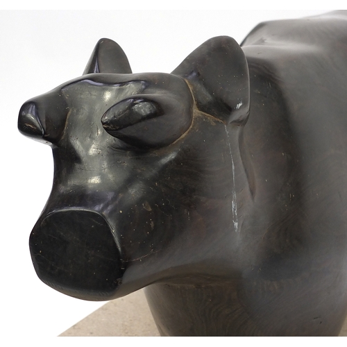 34 - Caroline Byng Lucas 1886-1967, Cow & Milkmaid, large African hardwood sculpture on rectangular stone... 