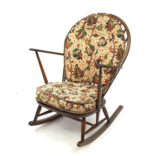 2061 - Ercol elm stick back rocking chair with floral upholstery, 96cm high