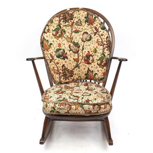 2061 - Ercol elm stick back rocking chair with floral upholstery, 96cm high