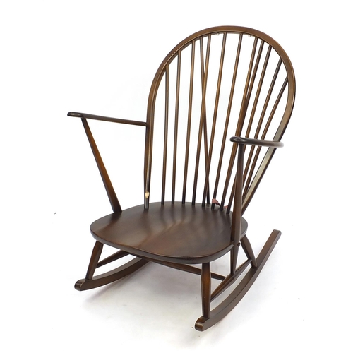 2061 - Ercol elm stick back rocking chair with floral upholstery, 96cm high