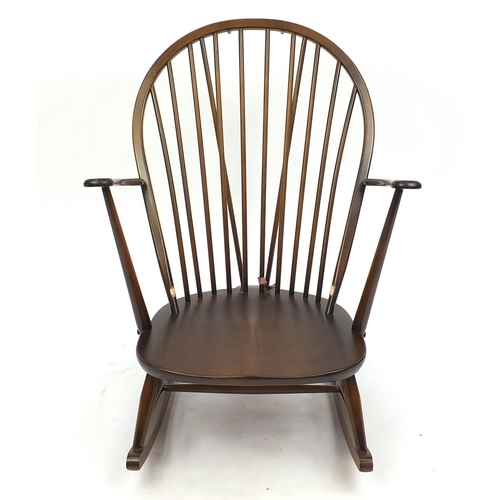 2061 - Ercol elm stick back rocking chair with floral upholstery, 96cm high