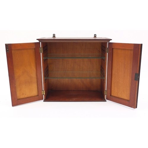 2053 - Mahogany two door wall hanging cupboard fitted with two glass shelves, 49cm H x 53cm W x 24cm D