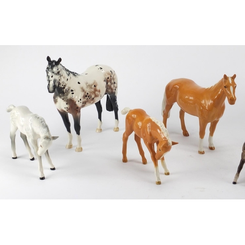 2368 - Seven Beswick horses and foals and an Appaloosa Royal Doulton example, the largest 24cm in length