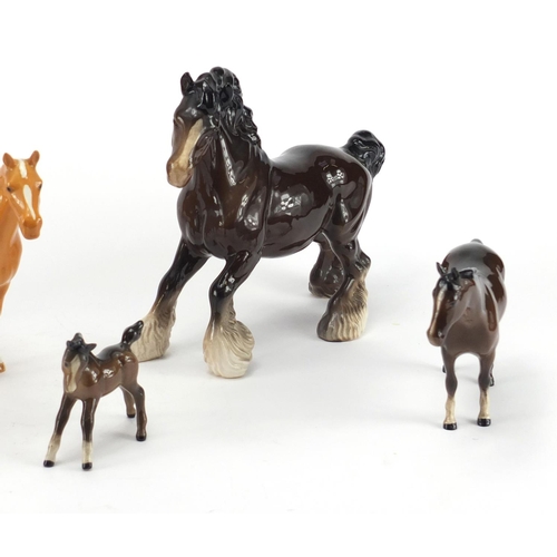 2368 - Seven Beswick horses and foals and an Appaloosa Royal Doulton example, the largest 24cm in length