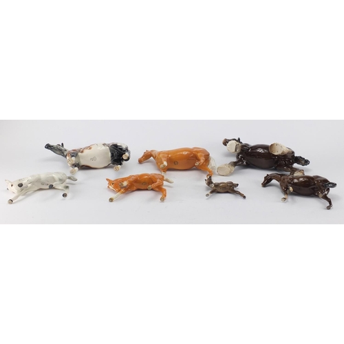 2368 - Seven Beswick horses and foals and an Appaloosa Royal Doulton example, the largest 24cm in length