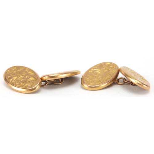 2636 - Pair of 9ct gold cuff links with floral chased decoration, approximate weight 2.9g