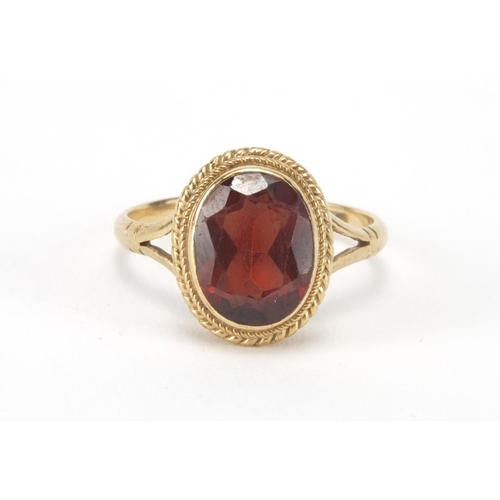 2629 - 9ct gold garnet solitaire ring, size I, approximate weight 2.1g