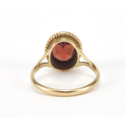 2629 - 9ct gold garnet solitaire ring, size I, approximate weight 2.1g