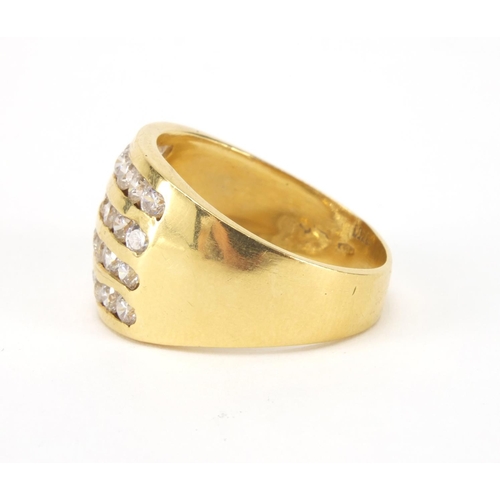 2538 - Stylish gold coloured metal ring set with four rows of clear stones, indistinct marks to the shank, ... 