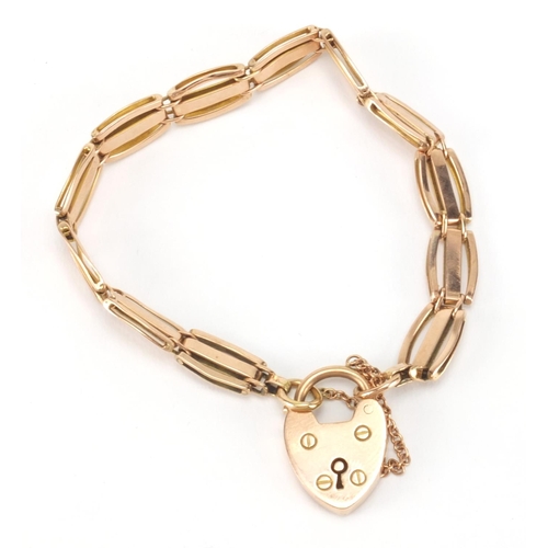 2522 - 9ct gold three row gate bracelet with love heart padlock, 16cm in length, approximate weight 12.2g