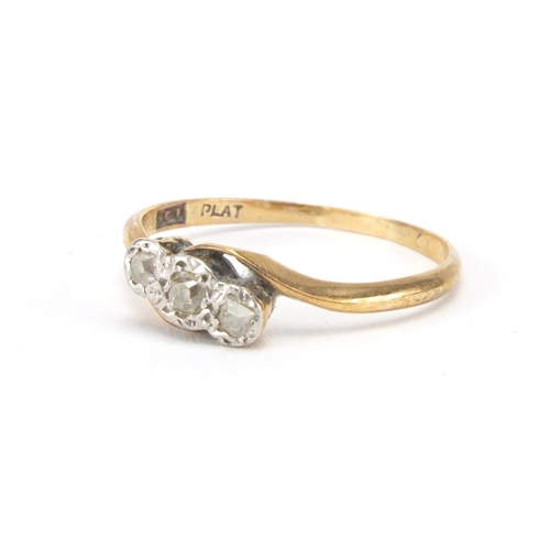 2564 - 9ct gold diamond three stone crossover ring, size R, approximate weight 1.6g