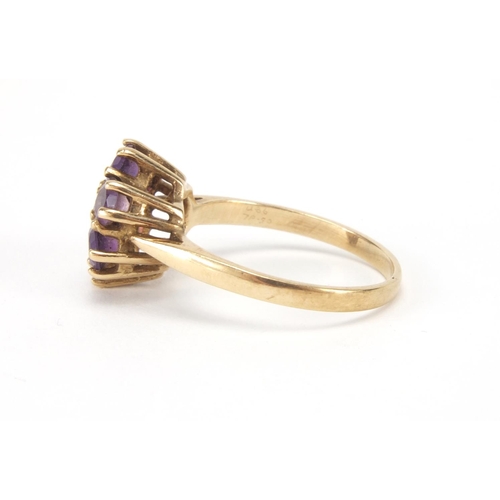 2637 - 9ct gold amethyst flower head ring, size O, approximate weight 3.0g