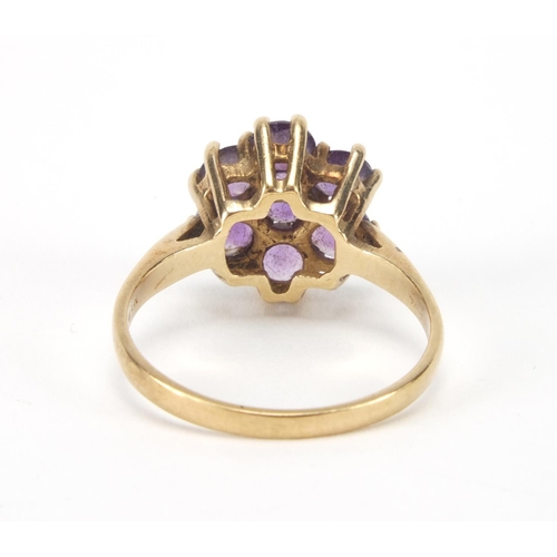 2637 - 9ct gold amethyst flower head ring, size O, approximate weight 3.0g