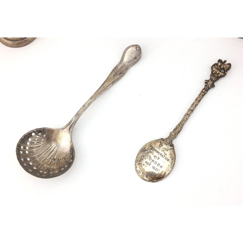 2407 - Silver items comprising three twin handle trophies, two spoons, rectangular vesta and a Guernsey sil... 