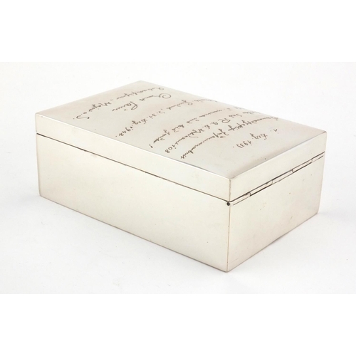 2418 - 800 grade silver cigar box with inscription to the hinged lid, 13.5cm in length, approximate weight ... 