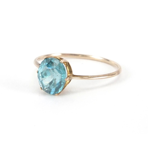 2601 - Unmarked gold blue stone solitaire ring, size M, approximate weight 1.2g