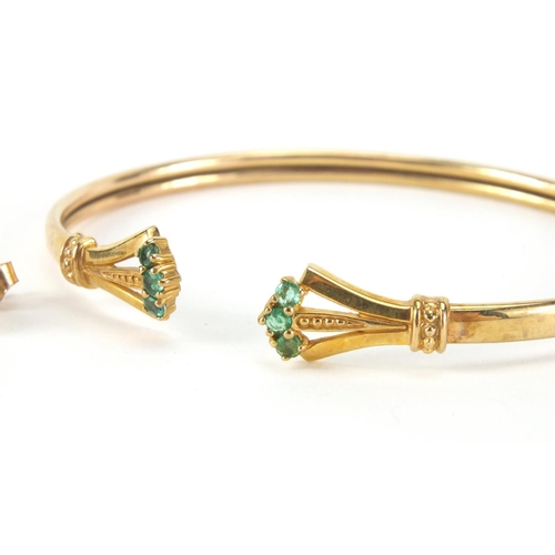 2519 - 9ct gold bracelet set with emeralds and a pair of 9ct gold emerald and diamond earrings, approximate... 