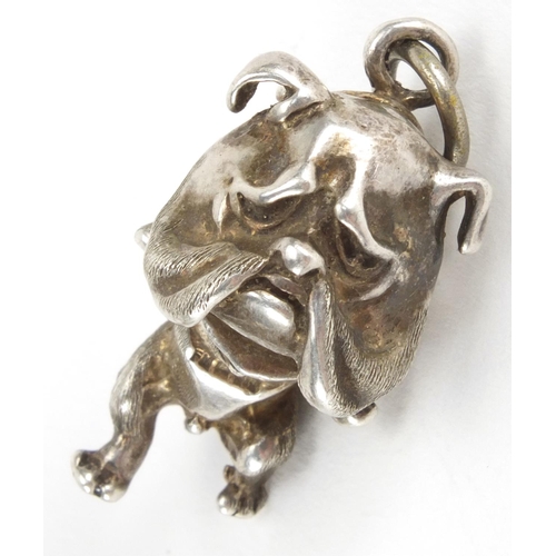 2419 - Novelty silver bulldog pendant and bull pendant, the largest 5cm in length, approximate weight  41.4... 