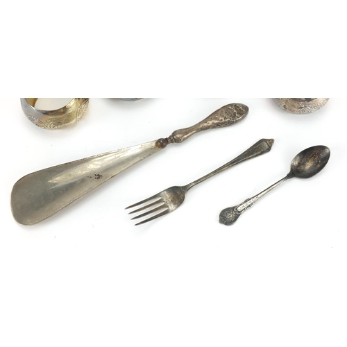 2431 - Silver items, set of four unmarked napkin rings, shoe horn, teaspoon and fork, various marks