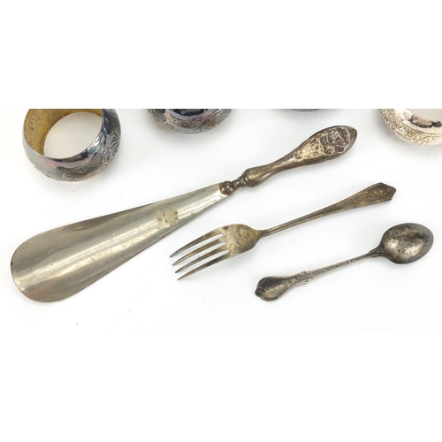 2431 - Silver items, set of four unmarked napkin rings, shoe horn, teaspoon and fork, various marks