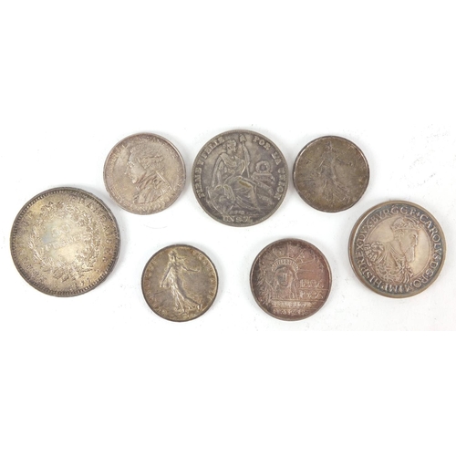 2477 - World coinage some silver including a 1977 fifty francs and 1934 one sol, approximate weight 131.0g