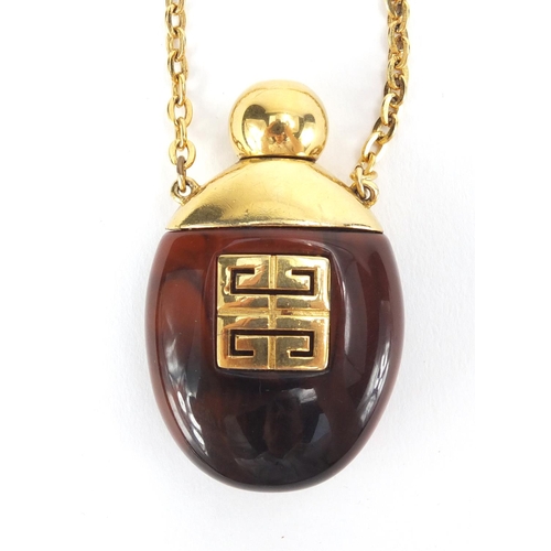 2394 - Givenchy Hautee Couture Bakelite perfume bottle on chain, the bottle 5cm in length