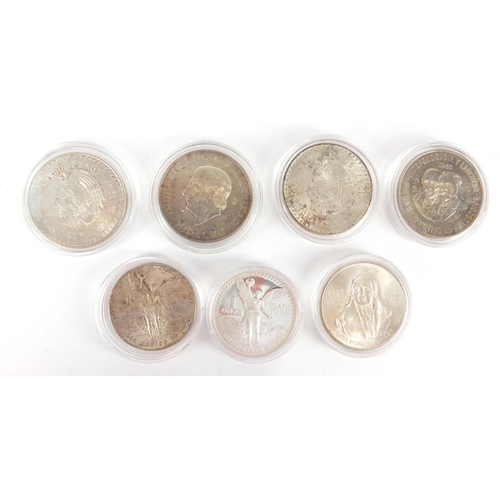 2465 - Seven South American silver coins including four Pesos and a 1987 Libertad angel, approximate weight... 