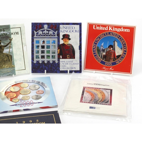 2460 - Eight United Kingdom uncirculated coin collections, 1985, 1990, 1991, 1994, 1995, 1996, 1997 and 200... 