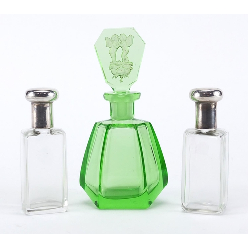 2395 - Pair of silver topped glass scent bottles together with an Art Deco green glass scent bottle, the st... 