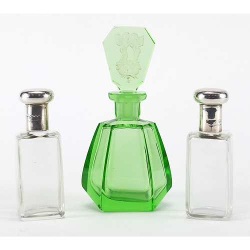 2395 - Pair of silver topped glass scent bottles together with an Art Deco green glass scent bottle, the st... 