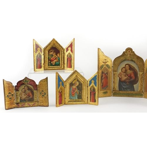 2399 - Seven religious gilt triptych icons, the largest 19cm high