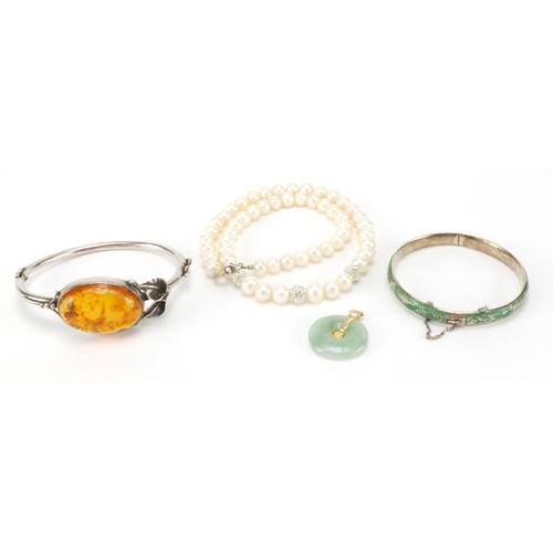 2616 - Assorted jewellery comprising silver and natural amber bangle, enamelled silver bracelet, cultured p... 