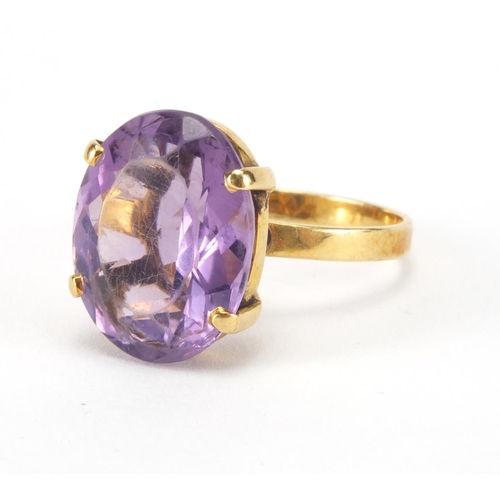 2566 - Gold coloured metal amethyst solitaire ring, indistinct mark to the shank, size M, approximate weigh... 