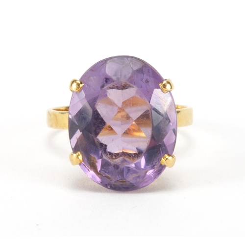 2566 - Gold coloured metal amethyst solitaire ring, indistinct mark to the shank, size M, approximate weigh... 