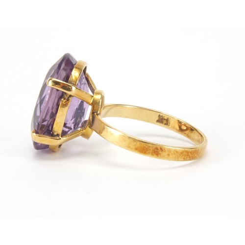 2566 - Gold coloured metal amethyst solitaire ring, indistinct mark to the shank, size M, approximate weigh... 