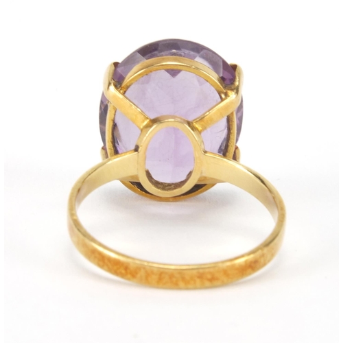 2566 - Gold coloured metal amethyst solitaire ring, indistinct mark to the shank, size M, approximate weigh... 