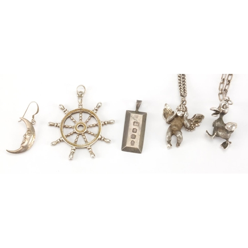 2658 - Five silver pendants - ships wheel, duck, cherub, ingot and moon together with two silver necklaces,... 