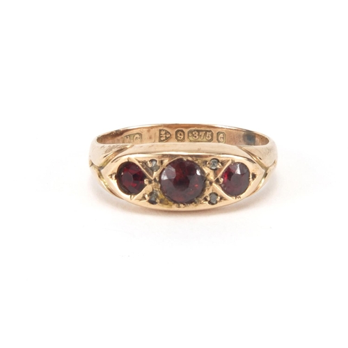 2595 - 9ct gold garnet and diamond ring, size K, approximate weight 1.8g