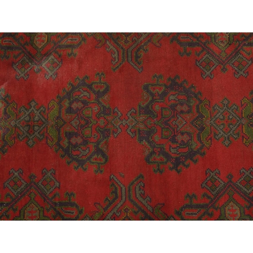 2065 - Rectangular Turkish Library Oushak rug, having all over geometric design onto a red ground, 230cm x ... 