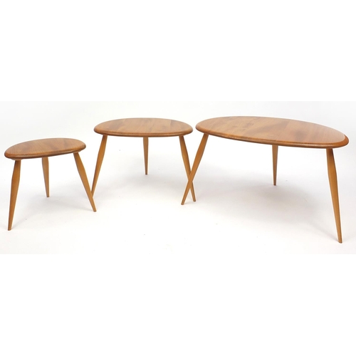 2029 - Ercol light elm nest of three pebble tables, the largest 40cm H x 65cm W x 44cm