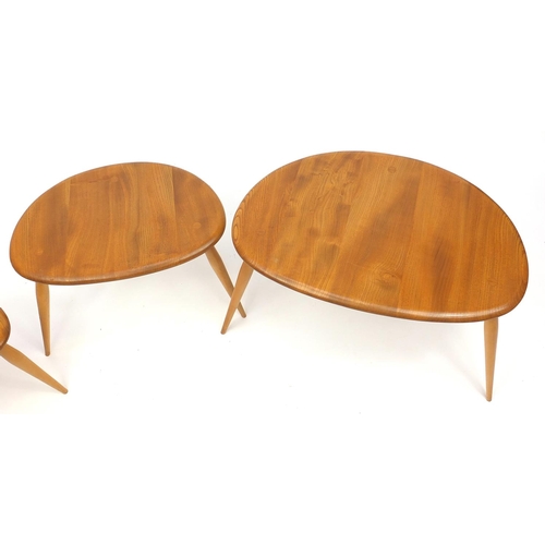 2029 - Ercol light elm nest of three pebble tables, the largest 40cm H x 65cm W x 44cm