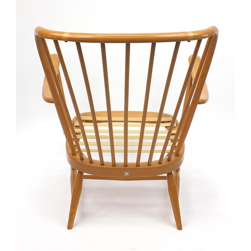 2049 - Ercol light elm stick back elbow chair with lift off upholstered cushions, 83cm high