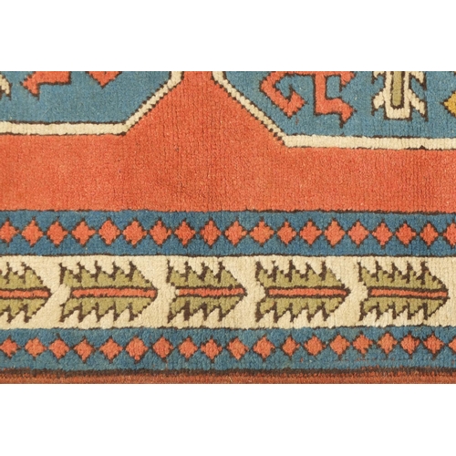 2045 - Rectangular Turkish Milas rug, having an all over geometric design onto a salmon ground, 210cm x 130... 