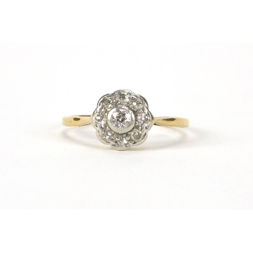 2545 - 9ct gold diamond flower head ring set with nine diamonds, size O, approximate weight 2.2g