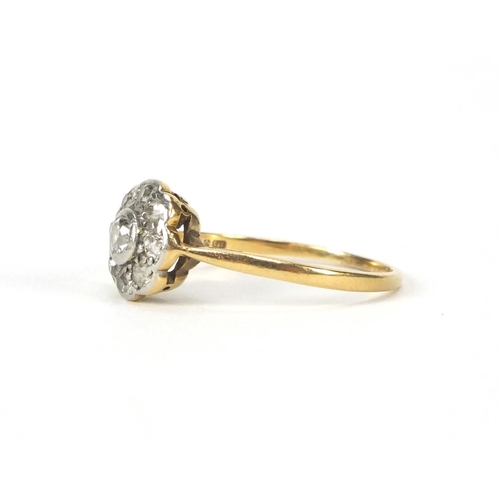 2545 - 9ct gold diamond flower head ring set with nine diamonds, size O, approximate weight 2.2g