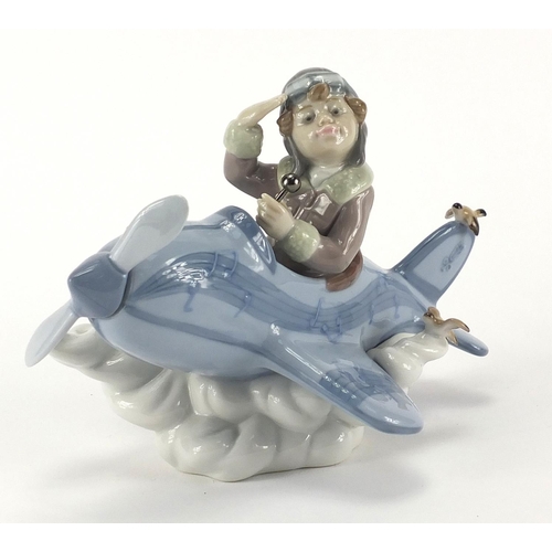 2363 - Lladro mode of a boy in a plane, 5697, 19cm in length